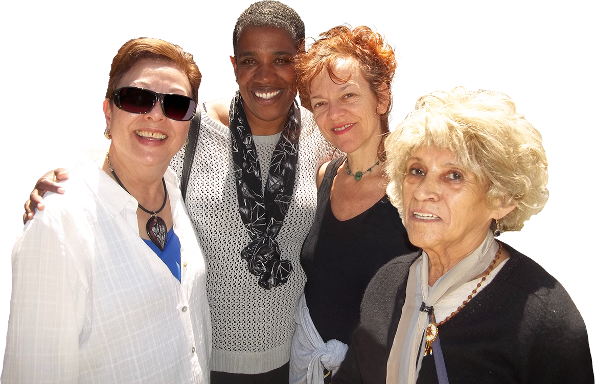 Photo of four ladies smiling together.